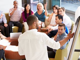 Man presenting in a team meeting.